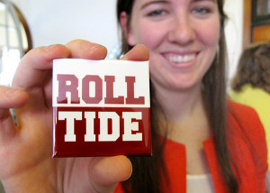 women holding Alabama Roll Tide button