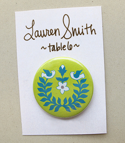 wedding escort card featuring button