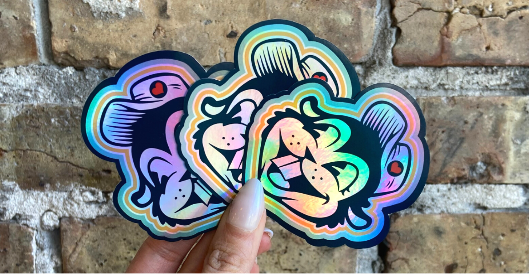 rainbow holographic die cut custom vinyl sticker of Bizzy the beaver from Busy Beaver