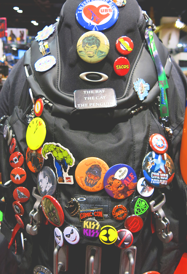 wom wearing comic con buttons on lanyard